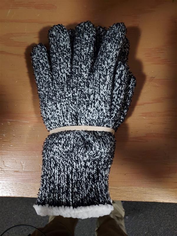 Picture of some grey and white gloves rubberbanded together